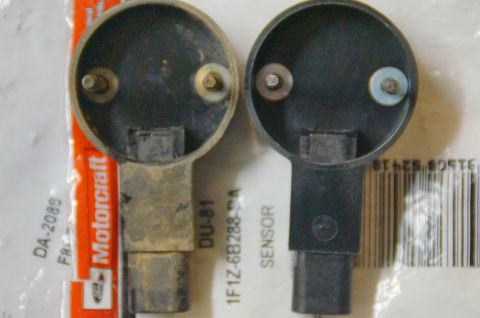 1998 Ford Ranger - Comparison of two vehicle sensors, one showing wear and the other appearing new, with part numbers visible.