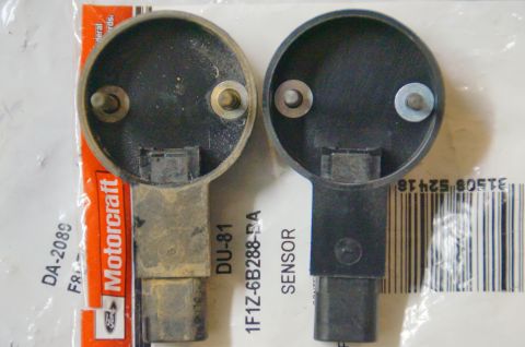 1998 Ford Ranger - Two automotive sensors are shown side-by-side, one appearing used and the other new, against a backdrop of packaging.