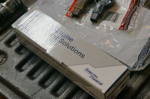 1998 Ford Ranger - A box labeled 'Engine Solutions' and 'Spectra Premium' is shown, along with some engine components.