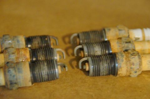 1998 Ford Ranger - A close-up view of multiple spark plugs, showing signs of wear and corrosion.