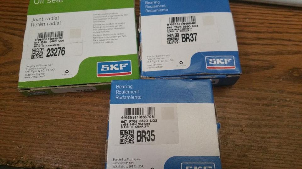 Three SKF boxes: oil seal 23276, bearing BR37, and bearing BR35