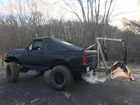 1989 Ford Bronco - This lifted 1989 Ford Bronco is equipped with a plow and engine hoist, ready for winter work.