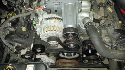 2005 Mercury Grand Marquis - Close-up view of a supercharged engine, the text "BOOST GETS YOU LAID" on the supercharger housing.