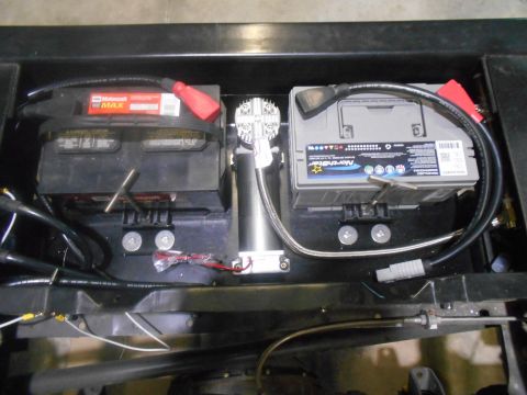 1992 Ford Bronco - Dual batteries and an air compressor are visible in this close-up view.