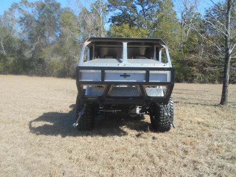 1992 Ford Bronco - This custom-built vehicle has a unique, utilitarian design with a prominent roll cage and off-road tires.