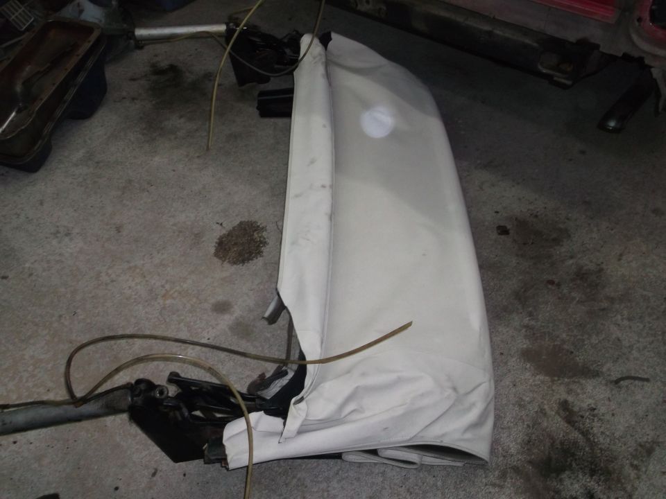 White convertible top folded and covered