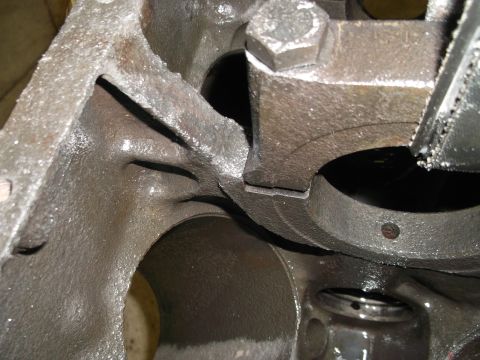 1969 Ford Mustang - This is a close-up view of an engine block with a connecting rod attached, showing mechanical components.