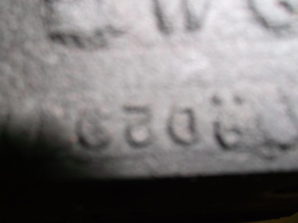 Close-up of a VIN plate with numbers and letters visible