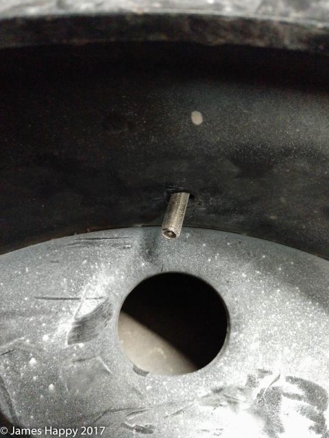 1989 Ford Bronco - after you get the first bead on, you go in and get the inner tube's valve stem installed and tightened. this will keep it in place when you…