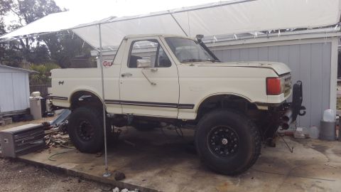 1988 Ford Bronco - moved the truck to cement for easier working on. also washed it and cleaned alot of old mud out