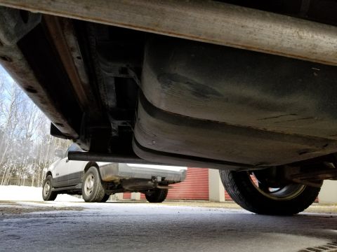 2001 Ford Crown Victoria - Photograph of a vehicle underbody showing tank and exhaust system; not a technical document.