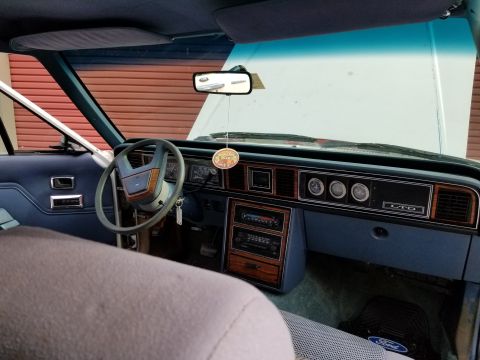 2001 Ford Crown Victoria - Photo of a Ford LTD interior showing dashboard and front seat, not a technical document.