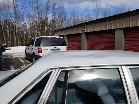 2001 Ford Crown Victoria - Photo over the roof of a sedan with a Ford SUV in the background, not a technical document.
