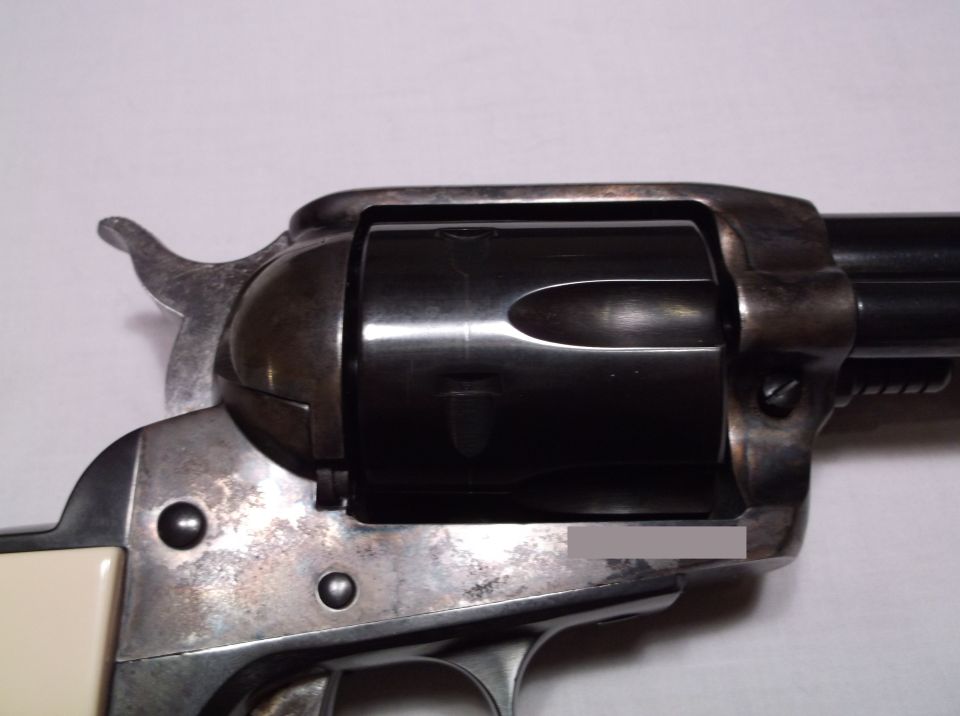 Close-up of a revolver cylinder and frame.