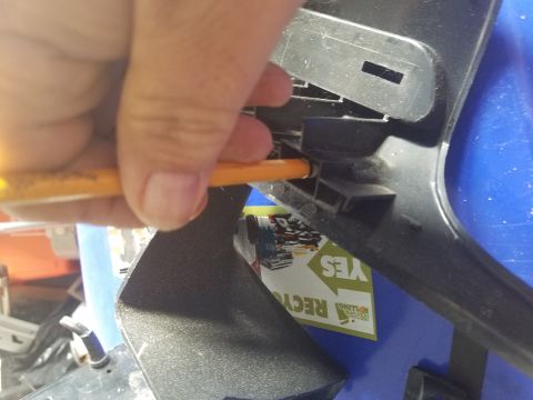 1994 Ford Bronco - Photograph of a plastic part being serviced, not a technical document.