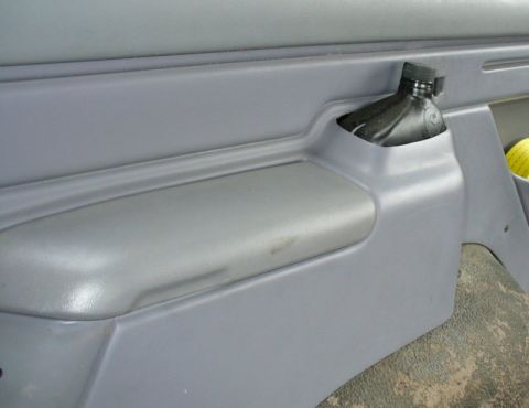 1992 Ford Bronco - Rear seat belt storage cubby.