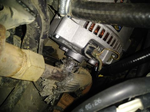 1996 Ford Bronco - Alternator and engine bay components shown, with visible wear on wiring and exhaust.