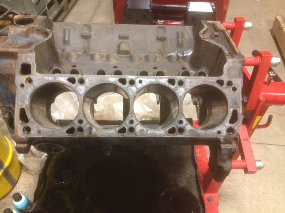 Engine block on a stand, showing cylinder bores