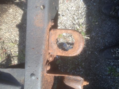 1979 Ford Bronco - This photo shows a heavily rusted tow hook and part of a vehicle's frame, not a complete vehicle.