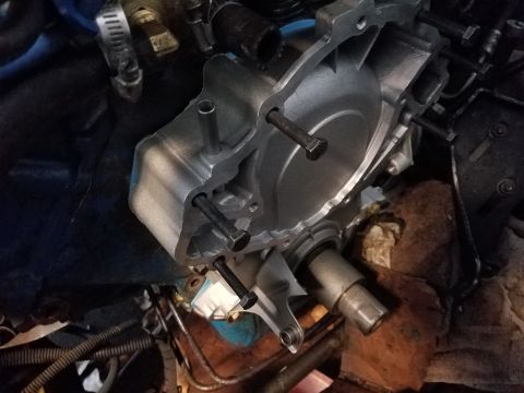 1976 Ford Ranchero - The water pump assembly is shown with several bolts in place, ready for installation or removal.