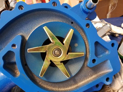 1976 Ford Ranchero - Water pump with impeller visible, part of a vehicle's cooling system.
