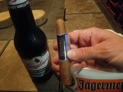 2018 Ford Bronco - A hand holds a cigar beside a bottle of Leinenkugel's beer.