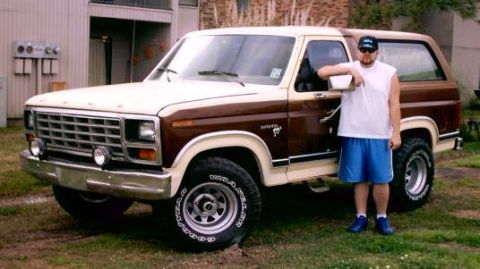 1980 Ford Bronco - A man poses with his Ford Bronco, which appears to be from the early 1980s.