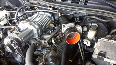 2005 Mercury Grand Marquis - Engine bay view showing a supercharger and intake system components.
