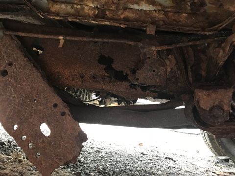 1989 Ford Bronco - The extensive rust on this vehicle's frame and undercarriage suggests significant structural compromise. The Supermotors.net logo is visibl…