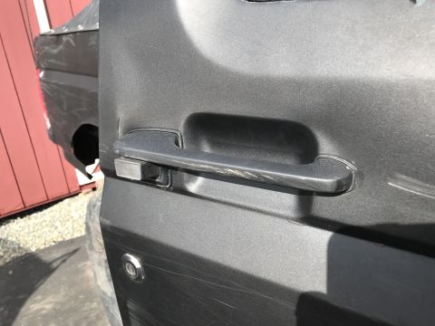1989 Ford Bronco - Close-up of a 1989 Ford Bronco door handle and lock cylinder.
