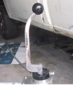 1969 Mercury Cougar - Close-up of a chrome aftermarket shifter with a black ball knob, installed in a vehicle.