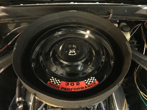 1969 Mercury Cougar - Close-up of an engine air cleaner assembly a '302 CUBIC INCHES HIGH PERFORMANCE' sticker.