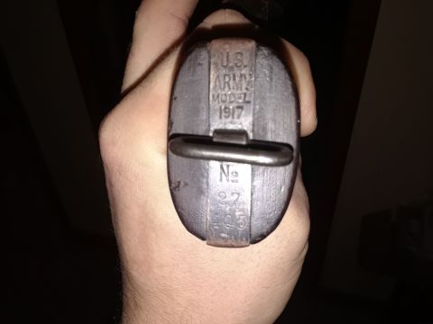 1994 Ford Bronco - Close-up of a U.S. Army Model 1917 part, showing markings and a serial number.