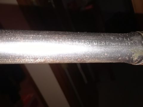 1994 Ford Bronco - Close-up of a metal rod with "UNITED STATES PROPERTY" stamped on it.