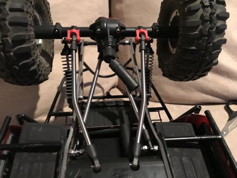 1989 Ford Bronco - Close-up view of the rear suspension and axle assembly of a remote-controlled vehicle.