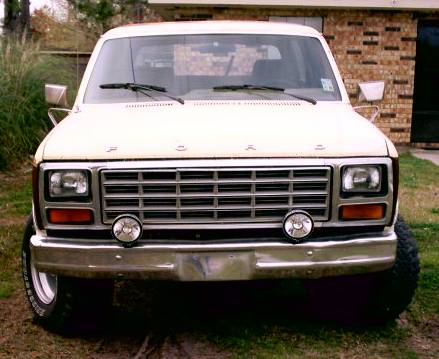 1980 Ford Bronco - This 1980 Ford Bronco is captured from a front-facing perspective, highlighting its distinctive grille and chrome bumper.