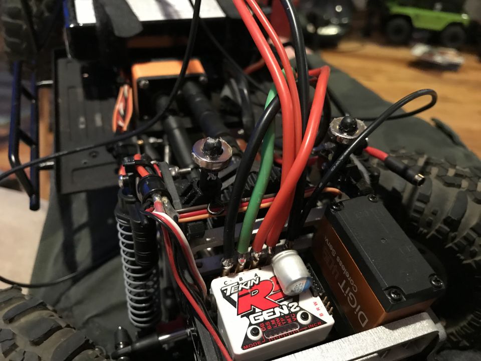 Close-up of RC car electronics, showing a Tekin R GEN2 ESC and a Digitize Coreless Servo