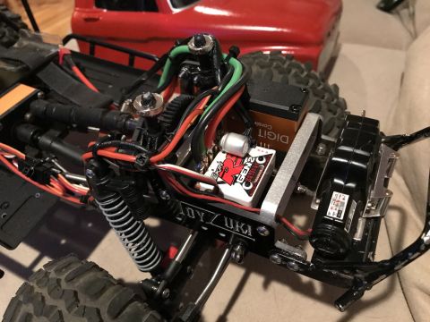 1989 Ford Bronco - Close-up of an RC car's internal components and chassis structure.