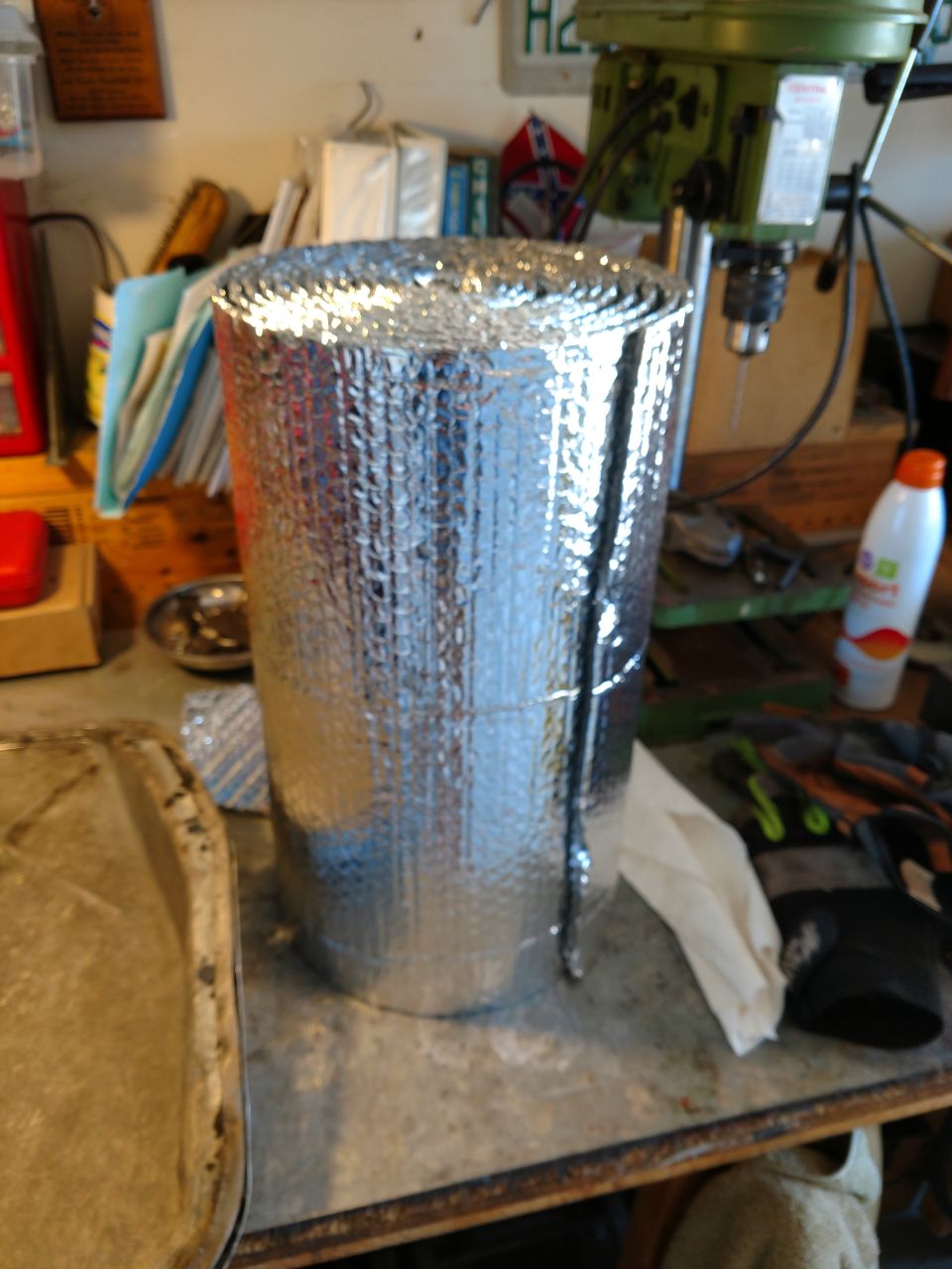 Roll of silver reflective insulation on a workbench