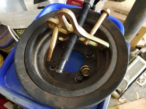 1976 Ford Ranchero - A pulley and a three-jaw puller tool are shown, likely for automotive repair.