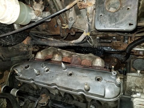 1991 Mitsubishi Montero - Close-up view of an engine bay, showing various mechanical components and wiring.