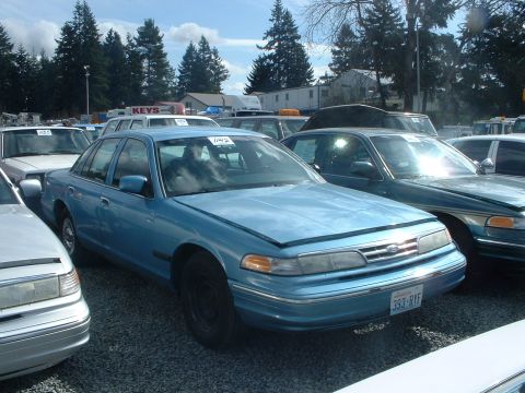 1999 Ford Crown Victoria - '96 retired Seattle Police PI. Looks like it may have been a repo car. Note the civilian license plate.
