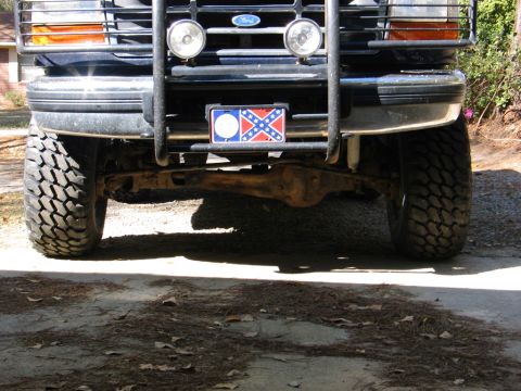 1995 Ford Bronco - Front view of a 1995 Ford Bronco, equipped with large tires and a brush guard.