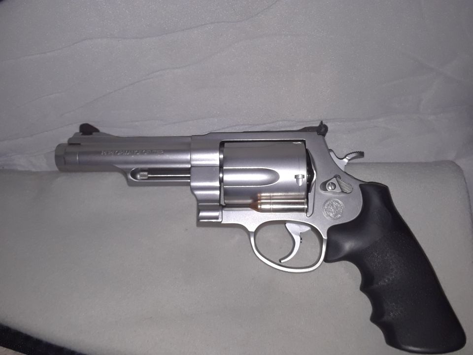 Silver revolver with black grip