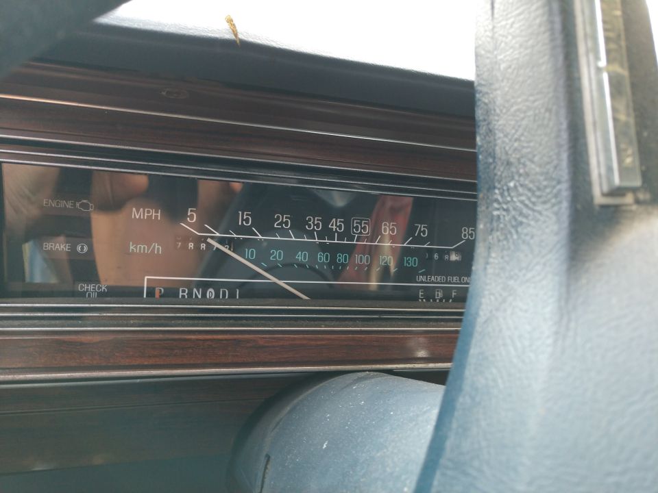 Dashboard gauges of a 1987 Ford Crown Victoria showing 5 MPH and Park gear selection.