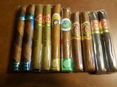 2018 Ford Bronco - A variety of cigars are displayed in their individual plastic wrappers on a brown surface.
