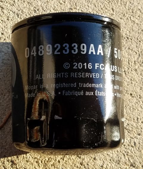 2000 Ford Crown Victoria - Oil filter with part number 04892339AA, manufactured in the USA, with a 2016 copyright date.