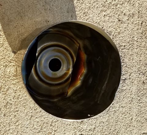 2000 Ford Crown Victoria - This is a close-up view of a vehicle's oil pan, showing signs of use and oil residue.