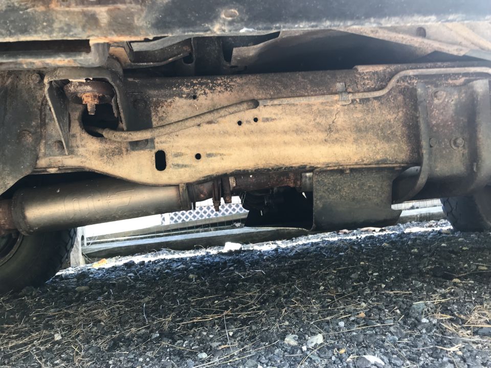 Underside view of a vehicle's frame and exhaust system