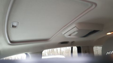 2007 Dodge Durango - Interior view of a vehicle's sunroof and overhead console, with a watermark for SuperMotors.net visible.